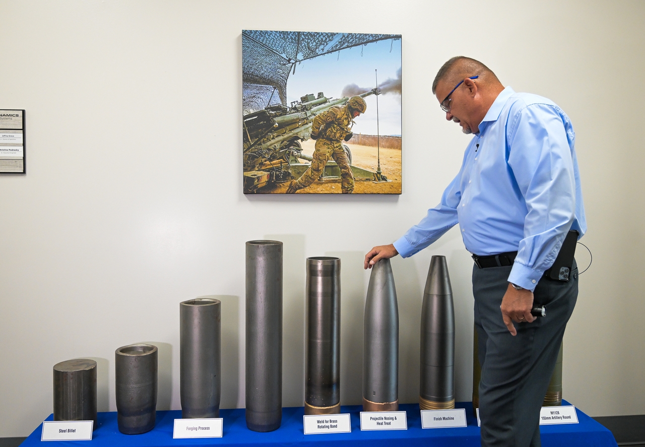 Richard Hansen, the Army commander's representative at the Scranton Army Ammunition Plant, leans on an artillery display during a tour of the manufacturing process of 155 mm artillery projectiles in Scranton. There are currently a little over $418 million worth of modernization projects underway at SCAAP.