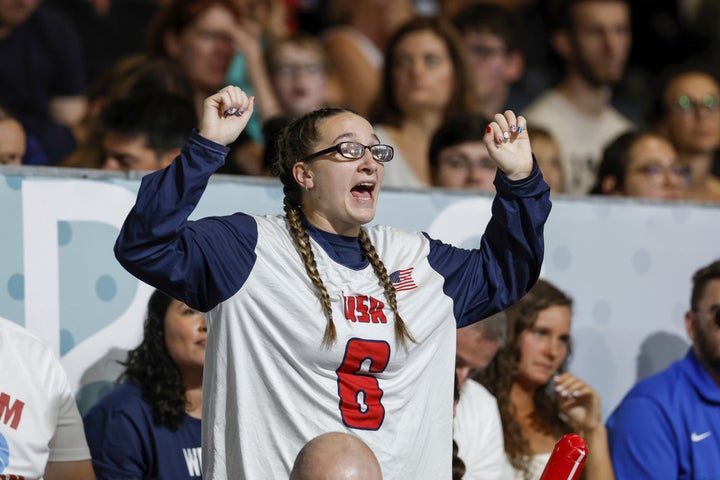 Eliana Mason, fiancé of American goalball team captain Calahan Young, cheers during the mens' United States versus France goalball game during the Paralympic Games in Paris, Saturday, Aug. 31, 2024. (AP Photo/Felix Scheyer)