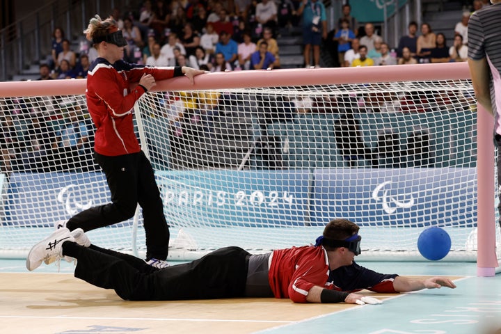 Calahan Young from the U.S. dives for a ball during a Paralympics goalball match against Brazil on Friday, August 30, 2024 at the South Paris Arena in Paris. (AP Photo/Nathalee Simoneau)