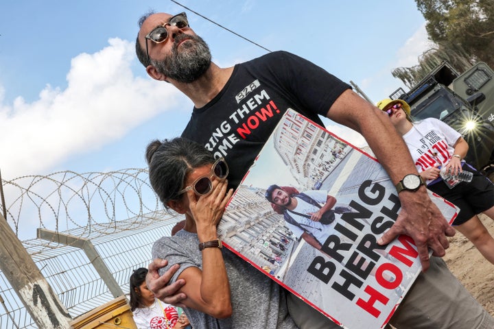 Jonathan Polin and Rachel Goldberg, parents of Israeli hostage Hersh Goldberg-Polin, attend a demonstration by families of Hamas captives calling for the hostages' release, near Kibbutz Nirim in southern Israel on Aug. 29. Israeli forces have recovered the bodies of six slain hostages, one of them being Goldberg-Polin.