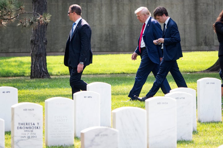 Former President Donald Trump leaves Section 60 of Arlington National Cemetery after attending a ceremony for service members who were killed at the Abbey Gate bombing during the U.S. withdrawal from Afghanistan, on Aug. 26 in Arlington, Virginia.