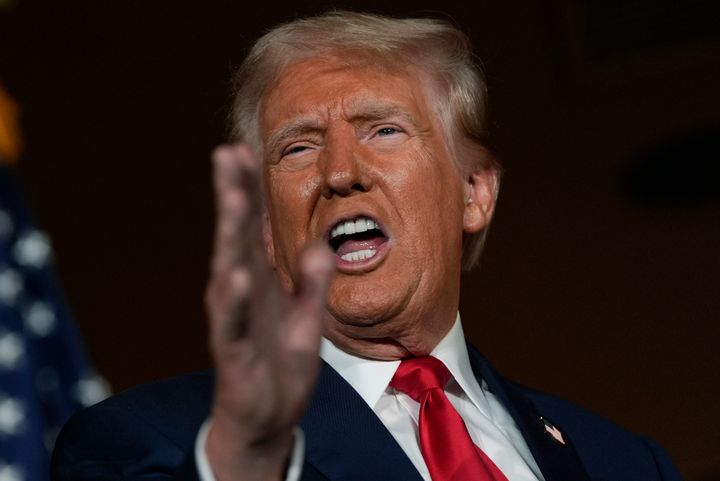 Republican presidential nominee former President Donald Trump talks with reporters at a campaign event at ll Toro E La Capra, Friday, Aug. 23, 2024.