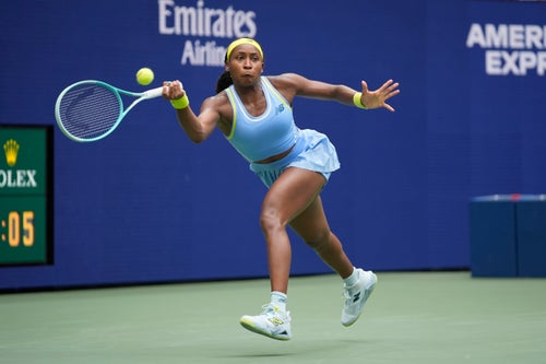 Coco Gauff, of the United States, returns a shot to Emma Navarro, of the United States, during the fourth round of the U.S. Open tennis championships.