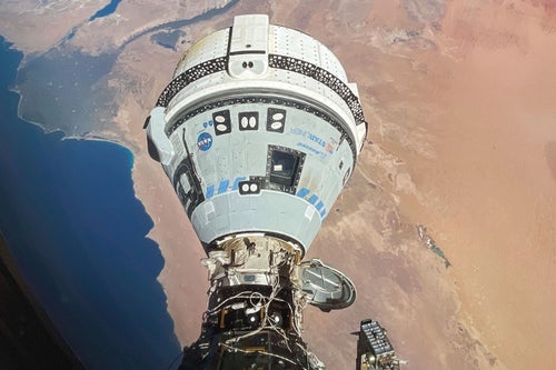 Boeing's Starliner spacecraft, seen docked with the International Space Station on June 13, is scheduled to return to Earth on Friday without passengers. 