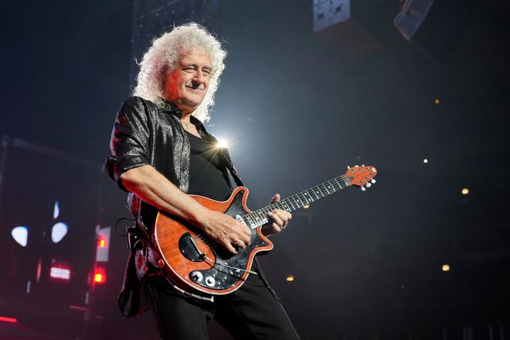 Brian May performing with Queen last year