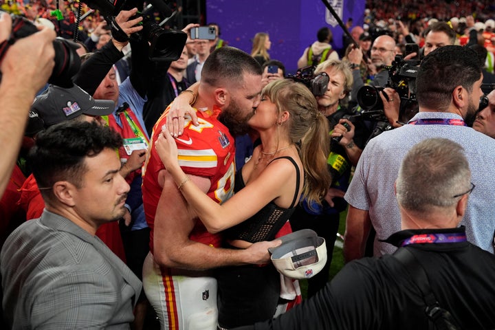 Travis Kelce and Taylor Swift share a kiss at the Super Bowl in February