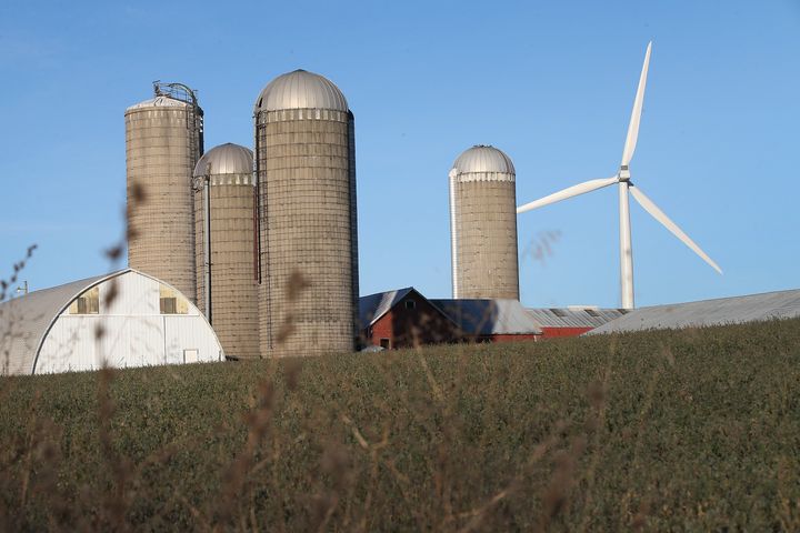 A wind turbine rises up above farmland on the outskirts of Middleton, Wisconsin. 