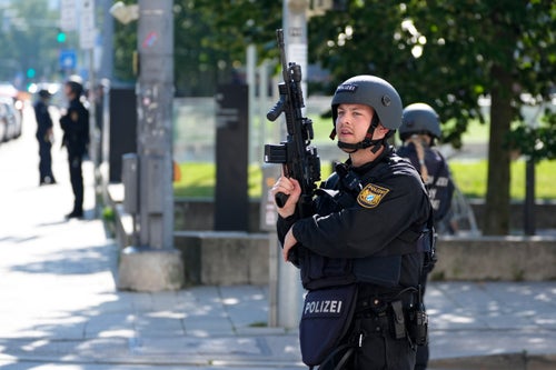 Police officers patrol near a scene after police fired shots at a suspicious person near the Israeli Consulate and a museum on the city's Nazi-era history in Munich, Germany, on Sept. 5, 2024.