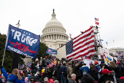 Insurrectionists loyal to President Donald Trump stand outside the U.S. Capitol in Washington on Jan. 6, 2021.