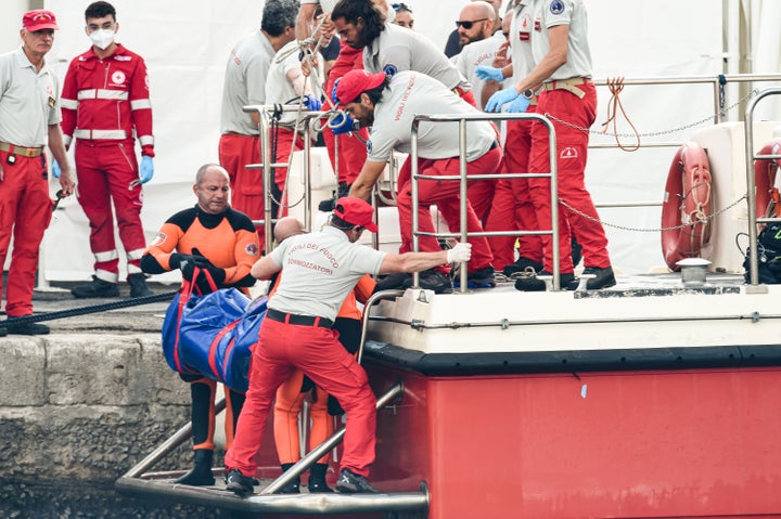 Italian firefighter divers bring ashore nan assemblage of 1 of nan victims of a shipwreck successful Porticello, Sicily, connected Aug. 22.