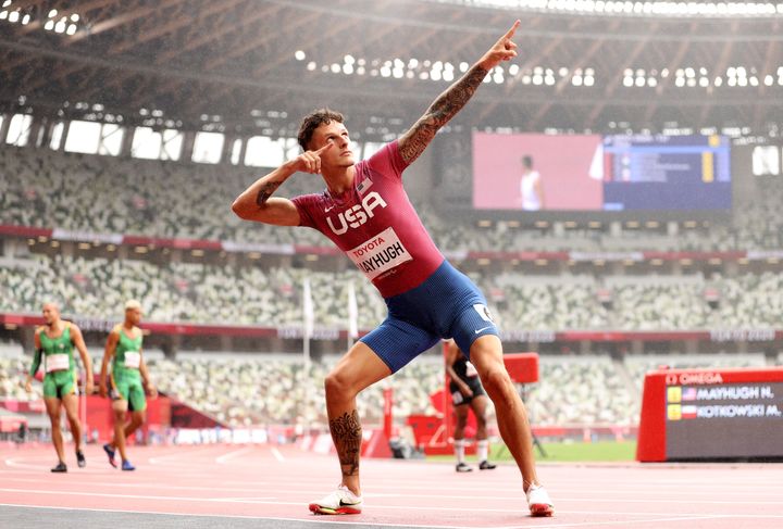 Mayhugh celebrates breaking the world record after competing in the men's 200-meter T37 final in Tokyo.