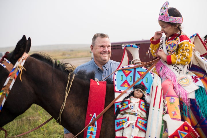 Sen. Jon Tester (D-Mont.) talks with constituents on Aug. 19, 2018, before a parade at Crow Fair in Crow Agency, Montana.