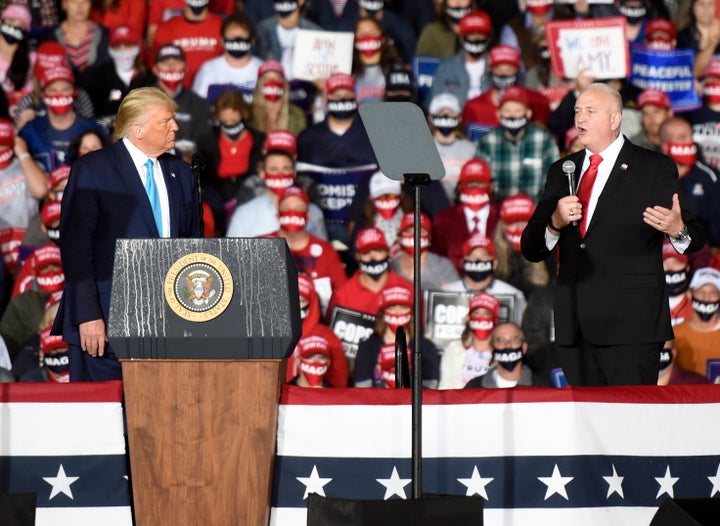 Then-President Donald Trump on Sept. 26, 2020, listens to Patrick Yoes, national president of the Fraternal Order of Police, at a Trump campaign rally in Middletown, Pennsylvania.