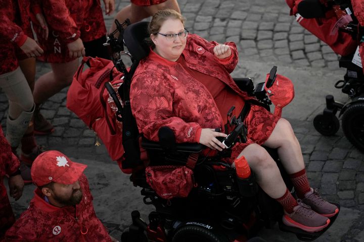 Canada's Alison Levine parades with her delegation during the opening ceremony.