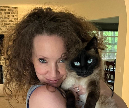 A recent photo shows the author. "I’m an exhausted, middle-aged, certified cat lady who is glad to finally be experiencing peace," she writes.