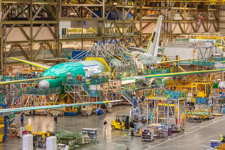 Boeing Factory workers assemble Boeing 777 airliners at the Boeing factory in Everett, WA. This building is said to be the largest building in the world under one roof.