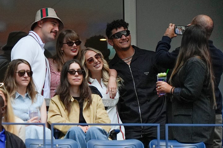 Travis Kelce, Taylor Swift, Brittany Mahomes and Kansas City Chiefs quarterback Patrick Mahomes pose for a photo while watching the US Open