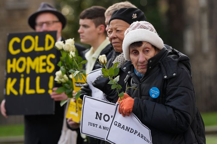 Fuel Poverty Action protesters holding placards in January 2023, as some pensioners were unable to heat their homes in winter due to rising fuel costs.