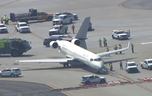 One of the planes is seen with a damaged tail after the collision Tuesday morning.