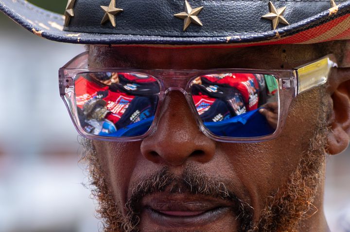 A vendor looks at his table of merchandise outside a rally for Trump in Johnstown.