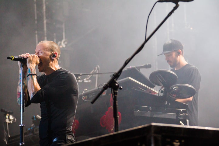 Linkin Park band members Chester Bennington and Mike Shinoda performing at the Nanjing Olympic Sports Center on July 17, 2015. 