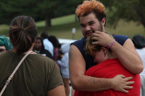 Artemis Else, right, hugs Angie Caswell as they wait outside Northwest high school after a shooting was reported Tuesday, Sept. 10, 2024, in Omaha, Nebraska.