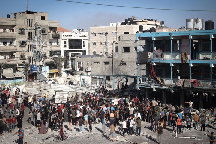 General News Palestinians stand in the courtyard of a school after an Israeli air strike hit the site, in Nuseirat in the central Gaza Strip on September 11, 2024. (Photo by EYAD BABA/AFP via Getty Images)