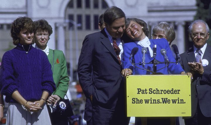 Rep. Pat Schroeder tears up and leans on her husband's shoulder after announcing she will not run for president in 1988.