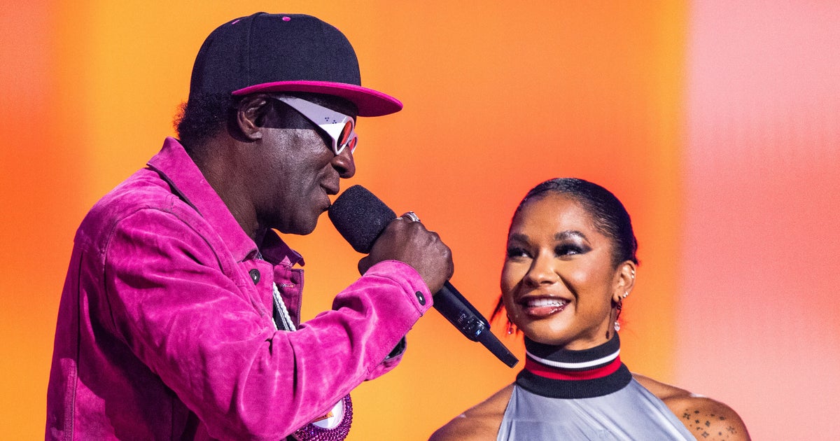 NextImg:Flavor Flav Honors Jordan Chiles With A Medal-Worthy Gift At VMAs
