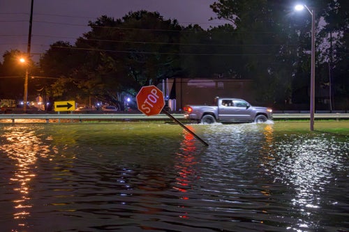 Water overflows the W. Napoleon Ave drainage canal into Neyrey Dr. after a deluge of rain from Hurricane Francine in Metairie, La., in Jefferson Parish, on Sept. 11, 2024.