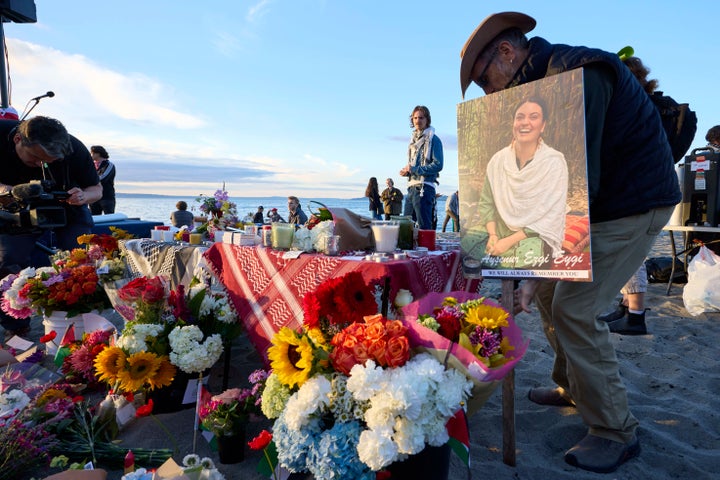 A photo is placed among flowers during a vigil on Alki Beach, Seattle, in memory of 26-year old Aysenur Ezgi Eygi, on Wednesday, Sept. 11, 2024. Israeli soldiers killed the human rights activist while she was serving as an international observer for Palestinians in the occupied West Bank.