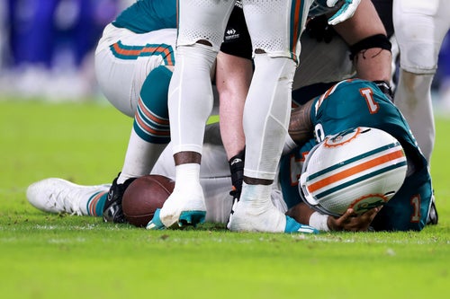 MIAMI GARDENS, FLORIDA - SEPTEMBER 12: Tua Tagovailoa #1 of the Miami Dolphins lays on the ground after colliding with Damar Hamlin #3 of the Buffalo Bills during the third quarter in the game at Hard Rock Stadium on September 12, 2024 in Miami Gardens, Florida. (Photo by Carmen Mandato/Getty Images)
