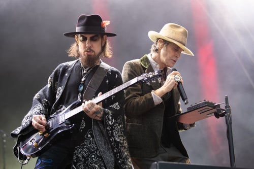 Jane's Addiction's Dave Navarro (left) and Perry Farrell (right) perform in Dublin, Ireland, on June 28. The band announced they were canceling the rest of their tour on Monday, days after lead singer Ferrell threw a punch at his guitarist on stage in Boston.