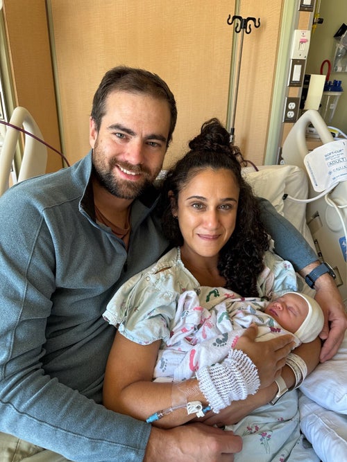 The author with her husband and newborn son.