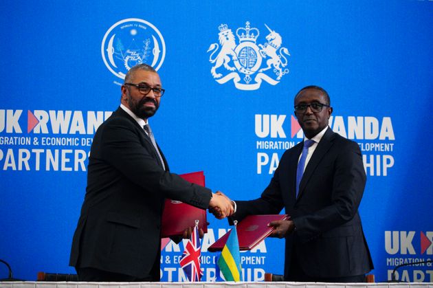 Former home secretary James Cleverly and Rwandan minister of foreign affairs Vincent Biruta shake hands after signing a new treaty last year.