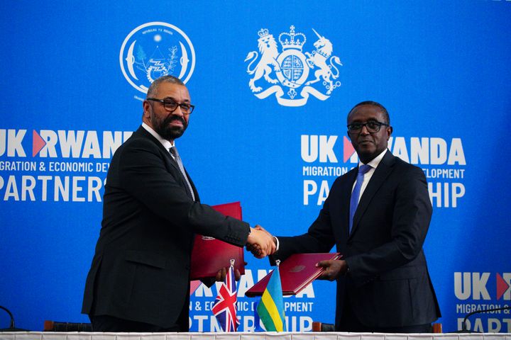 Former home secretary James Cleverly and Rwandan minister of foreign affairs Vincent Biruta shake hands after signing a new treaty last year.