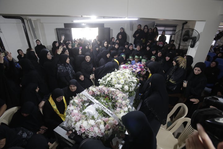 People attend the funeral ceremony held Wednesday for Fatima Abdullah in Lebanon.