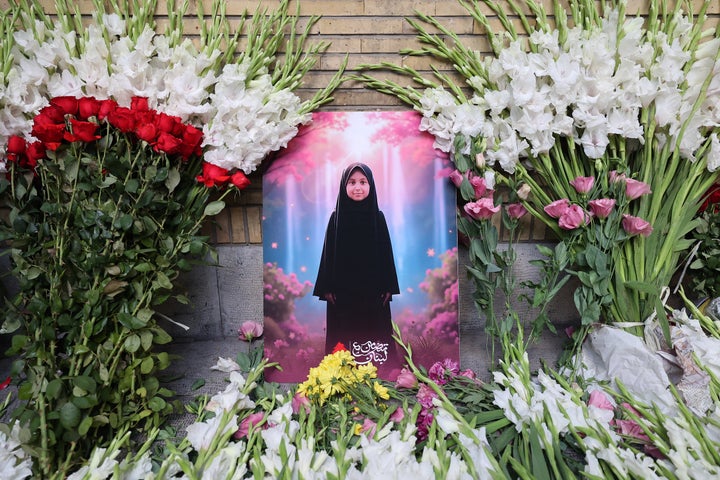 A child's picture is placed amid flowers at a memorial site set up outside Lebanon's embassy in Iran, on Sept. 18, 2024. At least 12 people, including two children, were killed in an attack involving pagers that exploded in Lebanon.