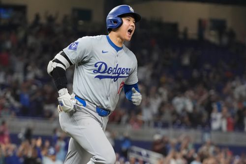 Los Angeles Dodgers' Shohei Ohtani (17) reacts after hitting his 50th home run of the season during the seventh inning of a baseball game against the Miami Marlins, Thursday, Sept. 19, 2024, in Miami.