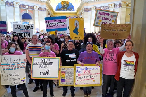 Trans rights activists protest outside the House chamber at the Oklahoma Capitol on Feb. 6, 2023, as the Republican-led legislature and Republican governor pushed through anti-trans measures that included barriers to obtaining voter ID with an appropriate gender marker.