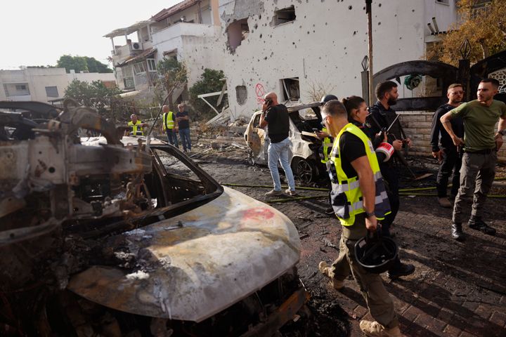 Israeli security forces examine the site of a rocket fired from Lebanon in Kiryat Bialik, northern Israel, Sunday, Sept. 22, 2024. (AP Photo//Ariel Schalit)