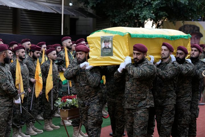 Hezbollah members carry the coffin of Hezbollah commander Ibrahim Akil during the funeral procession in Beirut's southern suburb, Sunday, Sept. 22, 2024. (AP Photo/Bilal Hussein)