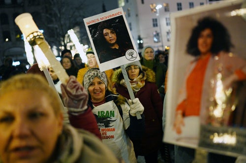 A torchlight procession in honor of jailed Iranian activist Narges Mohammadi in December after she received the 2023 Nobel Peace Prize.