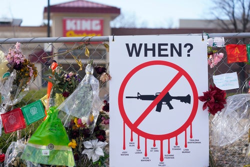 Tributes hang on a temporary fence surrounding the parking lot in front of a King Soopers grocery store in which 10 people died in a late March 2021 mass shooting, April 9, 2021, in Boulder, Colo.(AP Photo/David Zalubowski, File)