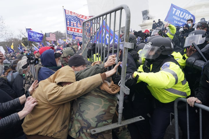 Protesters violently confront police in an effort to overturn the 2020 election results on Jan. 6, 2021, in Washington, D.C.