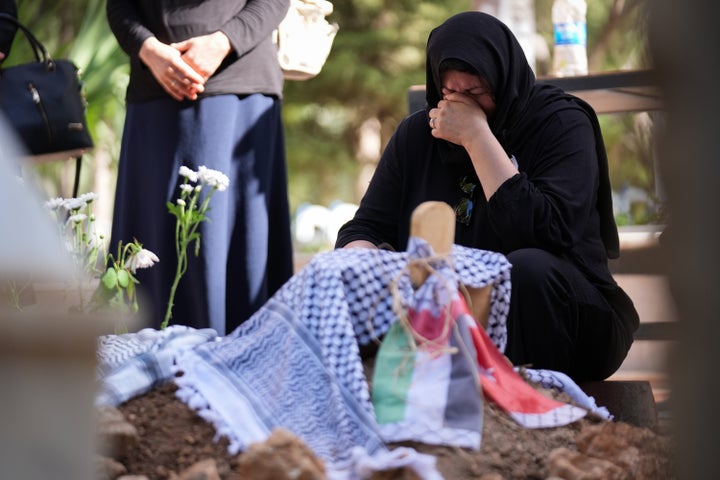 Turkish American activist Ayşenur Ezgi Eygi's mother, Rabia Birden, mourns at her daughter's grave in, Aydin, Turkey, on Sept. 14. Eygi, 26, was killed on Sept. 6 by Israeli forces during a peaceful protest against settlement expansions in the occupied West Bank's village of Beita.