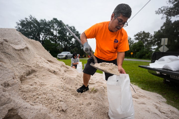 Jose Gonzales and his son Jadin Gonzales, 14, fill sandbags in Clyattville, Georgia, ahead of Hurricane Helene, expected to make landfall Thursday evening. (AP Photo/Mike Stewart)