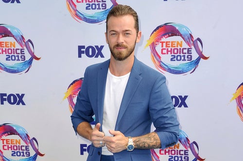 Artem Chigvintsev arrives at the Teen Choice Awards on Aug. 11, 2019, in Hermosa Beach, California.