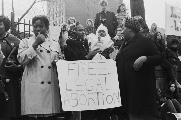 Protesters stand around a placard reading "free legal abortion" during a mass demonstration against New York state abortion laws, in the Manhattan borough of New York City, March 28, 1970.