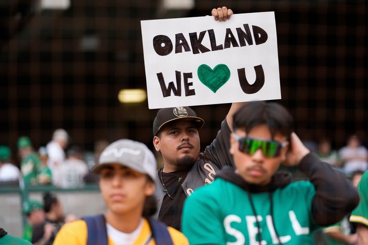 An Oakland Athletics fan holds up a sign before a baseball game against the Texas Rangers, Thursday, Sept. 26, 2024, in Oakland, Calif. (AP Photo/Godofredo A. Vásquez)